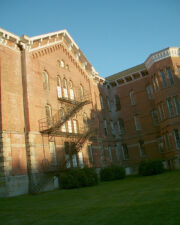 An outdoor fire escape scaled the side of the building.