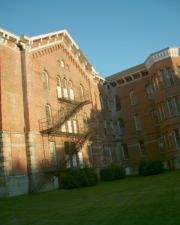 An outdoor fire escape scaled the side of the building.