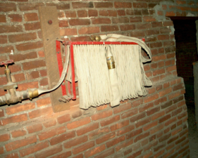 This fire hose attached to a riser almost looked brand new.