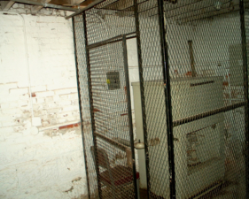 This cage was used to secure a piece of equipment, not for patients.