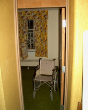 This creepy wheelchair remained in this patient room. At least the curtains were nice!