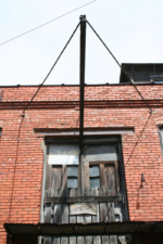 This exterior door allowed bulky items to be hoisted up to the second floor.