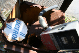 Directly behind this sign was an old gas pump.