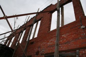 The support structure holding up the exterior wall in the northeast corner of the building.