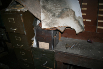 A couple more filing cabinets full of papers and a bid box.