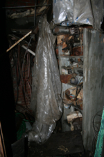Old rusted equipment sat on a shelf at the rear of the room.