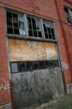 A large overhead door along West Walnut Street.