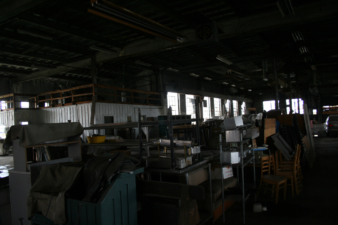 Items in storage where extruding machinery once sat.