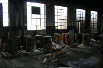 Several storage barrels sat along the east wall.