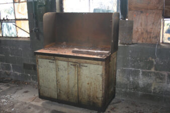 One of the half-dozen or so work benches left along the west wall.
