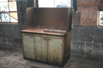 One of the half-dozen or so work benches left along the west wall.