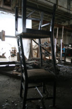 A couple of stacked kitchen chairs.