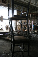 A couple of stacked kitchen chairs.