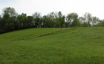 A large hill near the canoe access parking lot.
