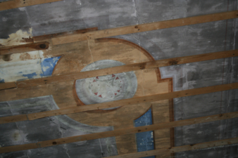 A closer look at a portion of the ceiling's original paint job.