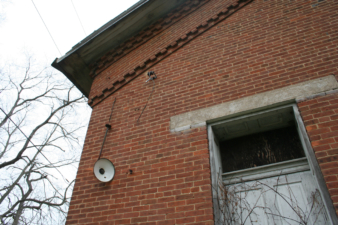 A 1930s-era electrical lighting fixture on the church's exterior.