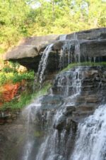 Water poured over the rock ledge.