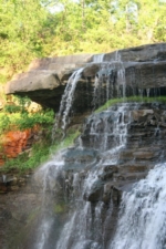 Water poured over the rock ledge.