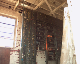 We could see a complex looking board system of some sort through the door.