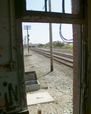 Looking out of the doorway and to the tracks.