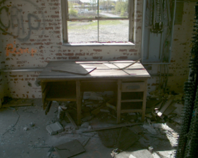 An old desk sat just inside the doorway.