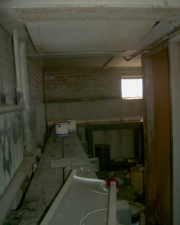 A long storage shelf lined the wall.