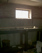 The long storage shelf continued around the corner.