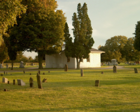 There was a small building at the center of the cemetery.