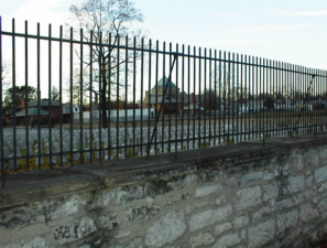 An iron fence was atop the stone wall that surrounded the Confederate cemetery.