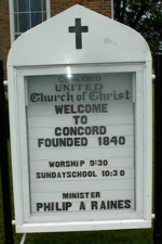 The sign that showed worship times and the presiding minister.