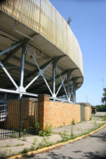 Weeds consumed the sidewalk that surrounded the stadium.