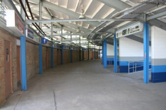 Restrooms were along the brick wall on the left. On the right were the concession stands.