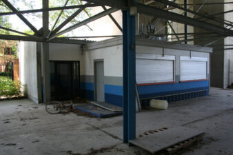 The glass door on the left opened to the stadium's office and was where the elevator to the skyboxes was located.