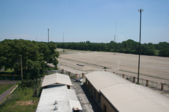 The stadium's vast parking lot will likely become part of a race track some day.