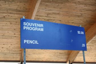 This sign just inside the pavilion gate listed game programs at two dollars and pencil for a quarter.