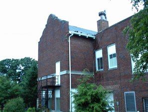 The view on the opposite side of the school. Notice the old lighting fixture on the corner of the downspout.