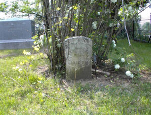 The tombstone of Civil War veteran David Peters. A newer marker for he and his wife can be seen in the background.