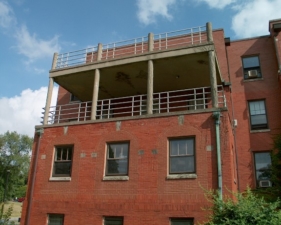 A double-tier balcony at the end of the building.