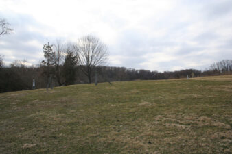 This grassy field behind the old Fairfield County Poorhouse likely contains 400-500 burials.