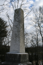 Erected in 1886, the tombstone simply read, "TO THE MEMORY OF OUR DEAD."