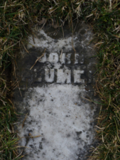 The tombstone of John Plumer. His date of birth and death are unknown.