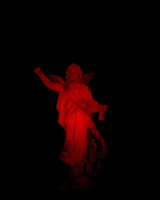 The statue on Pool's tombstone lit with a red light.