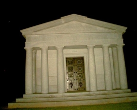 This large mausoleum, built in 1914, stand on top of a large hill.