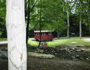 A small covered bridge carried park visitors over a creek.