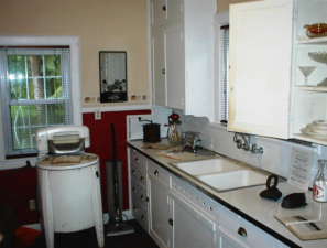 A kitchen was set up complete with old appliances.