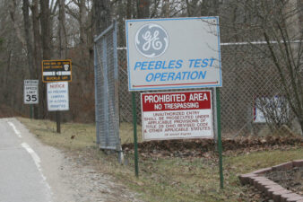 A closer look at the signs posted at the main gate.