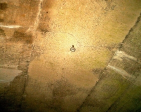 A very old light was in the middle of the overpass tunnel.