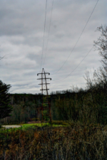 High voltage power lines go over the old tracks.