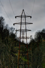 The electric lines go over the hill, west of the tunnel.