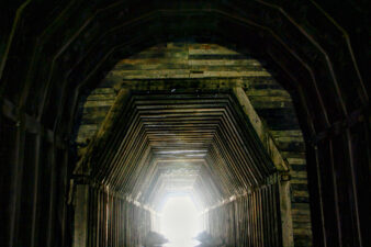 The transition from the larger tunnel to the smaller, more narrow section of tunnel.